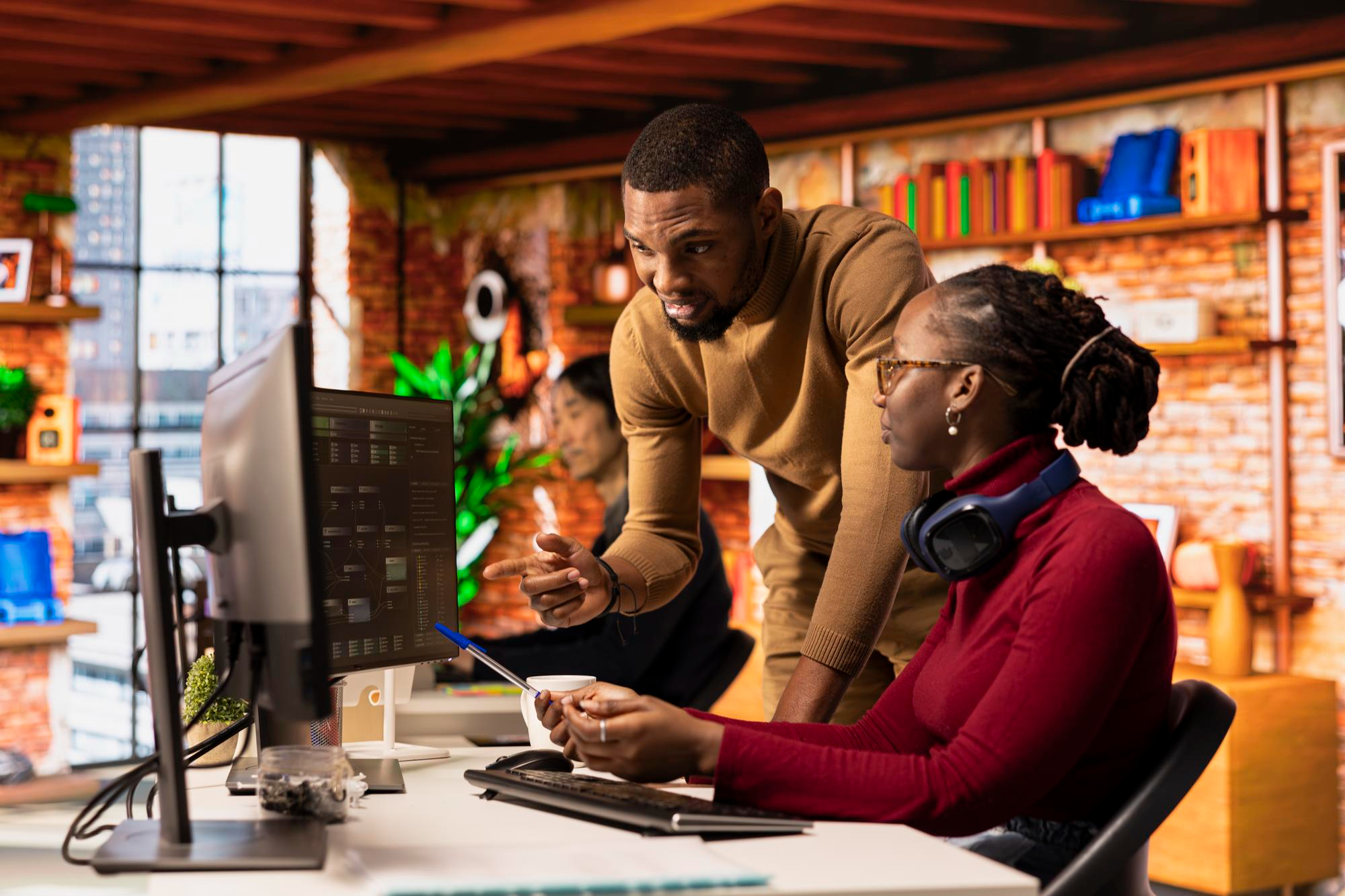 Student smiling while using a laptop